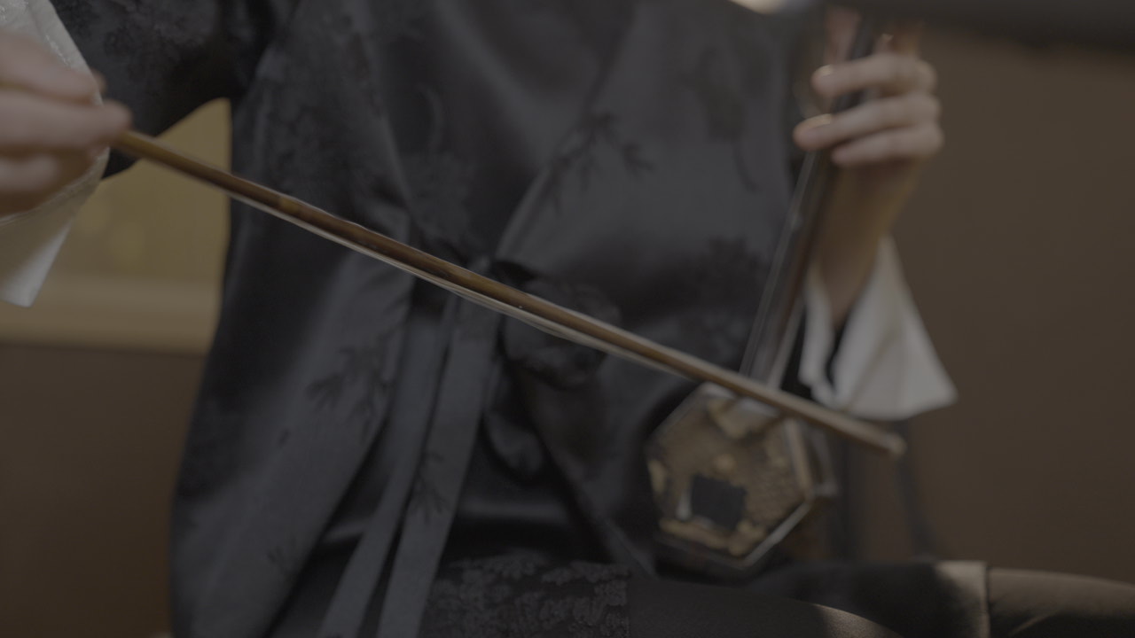 Close view of an erhu performance in the recording studio