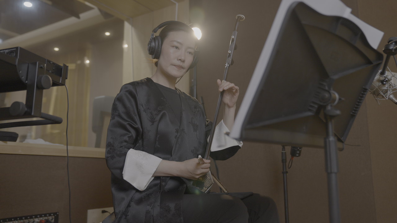 Erhu performer preparing in the recording studio